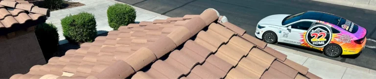 Tile roof with a 22 Home Roofing vehicle nearby