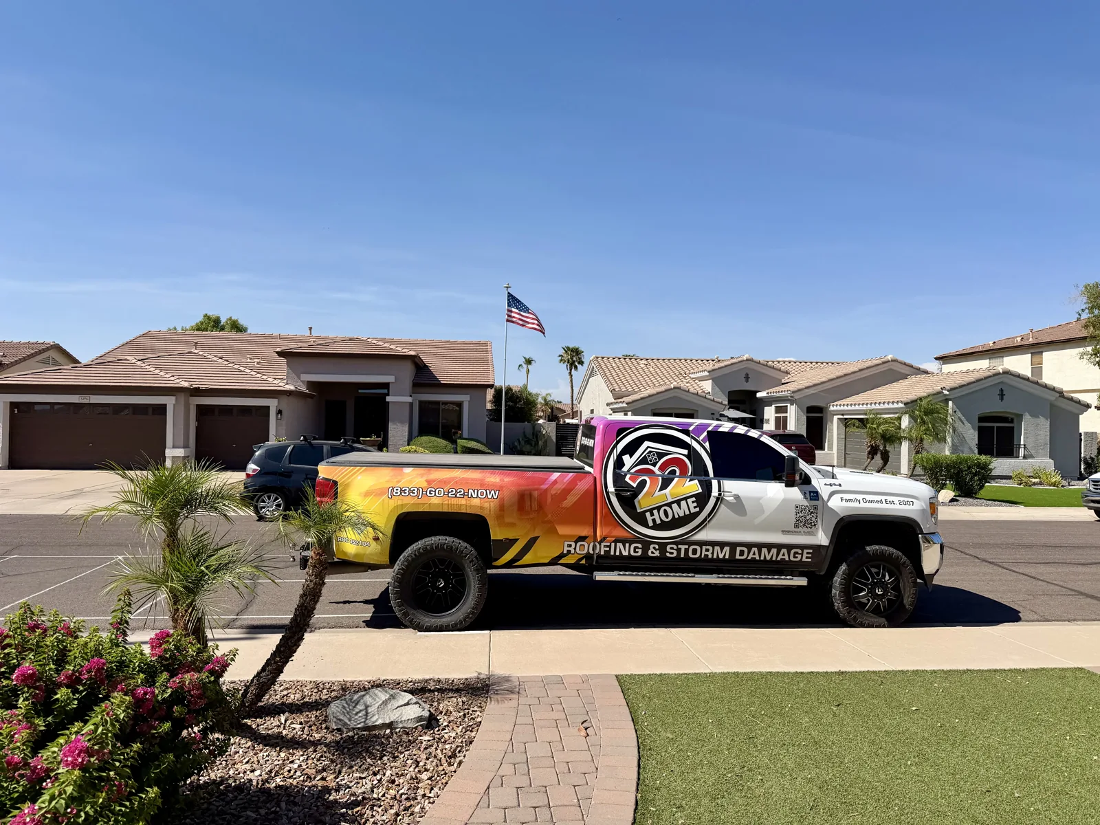 22 Home Roofing branded truck outside a neighborhood home